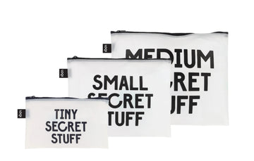Three transparent soft matte plastic pouches with black text, all three on a on a white background